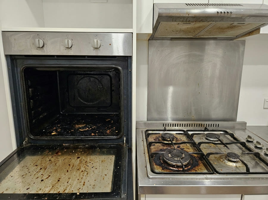 Greasy oven and stovetop before cleaning